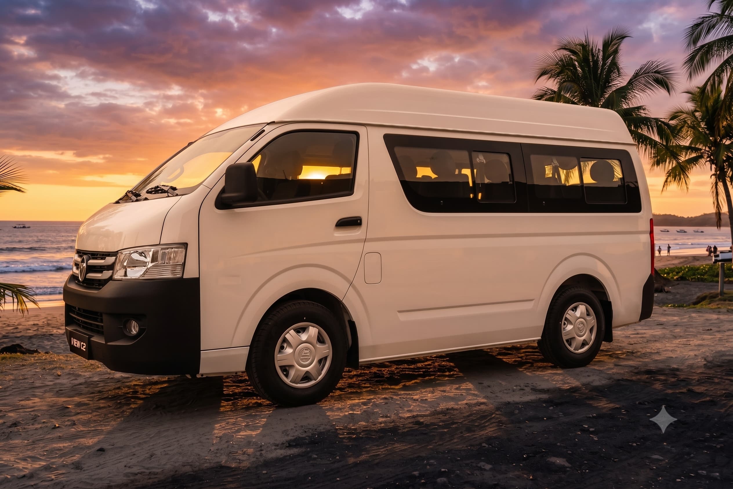Retana Transfers Tamarindo passenger van parked on the black sand of a Guanacaste beach at sunset, palm trees and the Pacific behind it